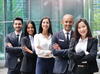 a group of business people posing for a photo